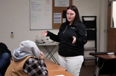 Wolf Rive Electric Employee Explaining Benefits of Solar With a Classroom